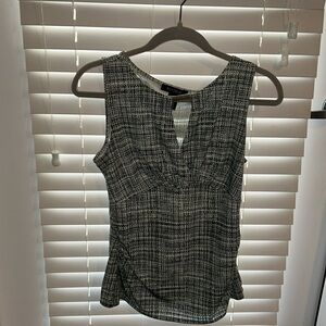 Dressy green and black sleeveless blouse from White House Black Market, size S.